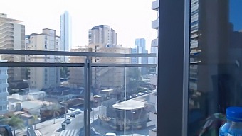 Sexy Video Game Enthusiast In Clothing Reveals Herself On Balcony In The Open Air